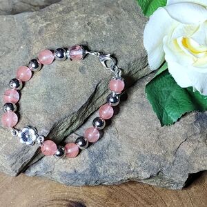 Hand Crafted Pink and Silver Toned Beaded Bracelet With Flower Accent
